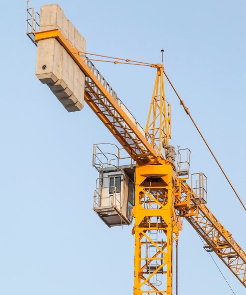 yellow-construction-crane-against-the-blue-sky-infrastructure.jpg